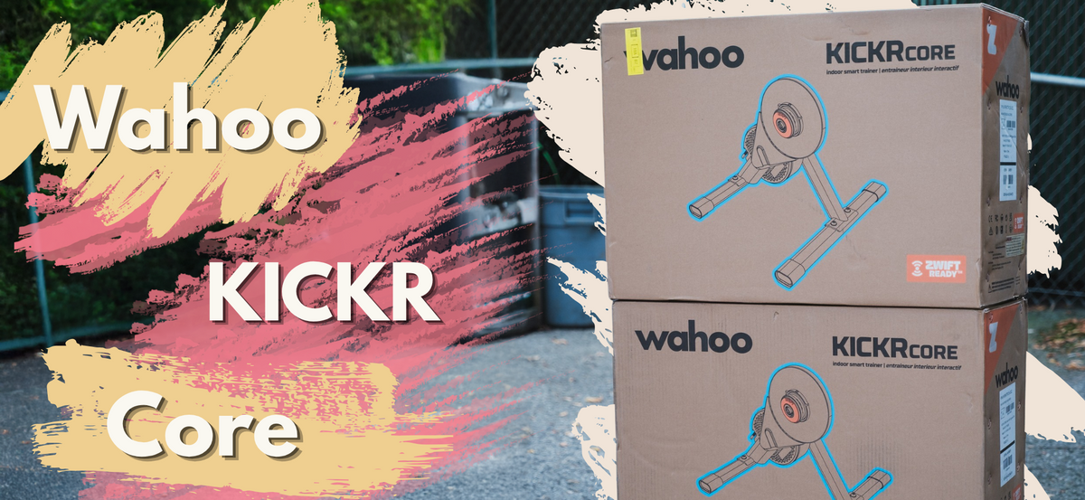 Two stacked cardboard boxes of Wahoo KICKR Core exercise equipment on an outdoor paved surface, with a colorful graphic overlay on the left.